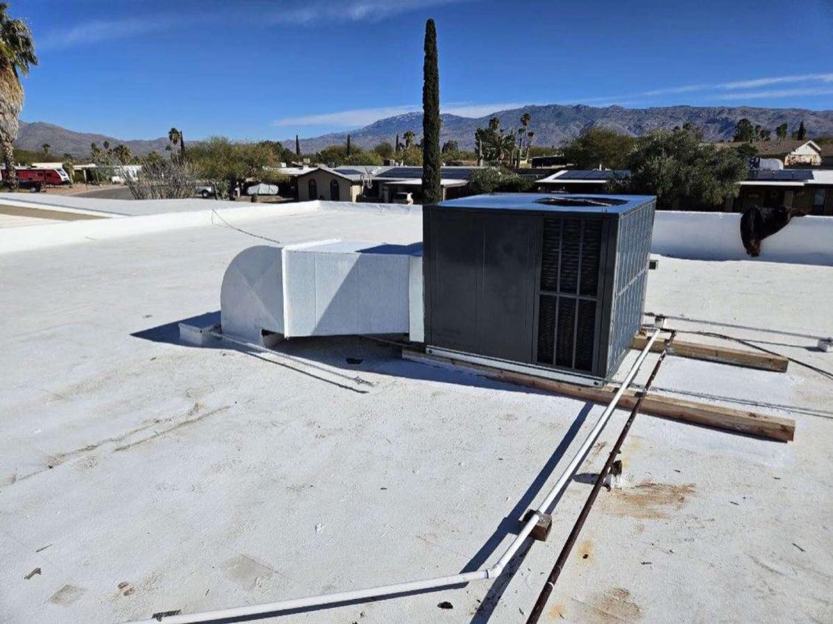 Rooftop heating and cooling package unit with Tucson mountains behind it