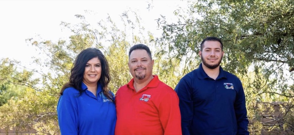 Three members of the Picture Rocks team outdoors in Tucson